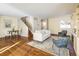 Inviting living room with hardwood floors, comfortable seating, and a staircase leading to the upper level at 780 Utica Ave, Boulder, CO 80304