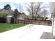 Fenced backyard featuring mature trees, shed, and concrete patio with outdoor table at 19038 E Girard Ave, Aurora, CO 80013
