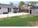 Landscaped backyard with lush green grass, patio, pergola, and storage shed at 19038 E Girard Ave, Aurora, CO 80013
