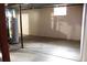 Basement with concrete floor, utilities, and natural light from a window at 19038 E Girard Ave, Aurora, CO 80013