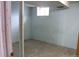 Unfinished basement featuring concrete floors, support beam, and a small window at 19038 E Girard Ave, Aurora, CO 80013