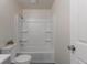 Bright bathroom showcasing a tub-shower, white fixtures, and simple design at 19038 E Girard Ave, Aurora, CO 80013