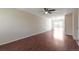 Spacious living room with gleaming hardwood floors and a ceiling fan for added comfort at 19038 E Girard Ave, Aurora, CO 80013