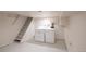Utility room with a washer and dryer and open stairs to the main level of the home at 3071 W 38Th Ave, Denver, CO 80211