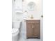 Chic powder room featuring a modern vanity, elegant fixtures, and marble flooring at 3071 W 38Th Ave, Denver, CO 80211