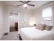 Bedroom featuring a comfortable bed, ceiling fan, and an open doorway to another room at 3071 W 38Th Ave, Denver, CO 80211