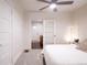 Bright bedroom featuring a comfortable bed, ceiling fan, and an open doorway at 3071 W 38Th Ave, Denver, CO 80211