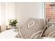 Comfortable pillows on bed with a small plant on side table at 3071 W 38Th Ave, Denver, CO 80211