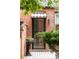 Charming brick entryway with an arched awning and decorative planter at 3071 W 38Th Ave, Denver, CO 80211