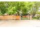 Gated property featuring a combination of wood and brick fencing for privacy and curb appeal at 3071 W 38Th Ave, Denver, CO 80211