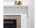 Elegant fireplace featuring a white mantle, decorative accents, and classic design at 3071 W 38Th Ave, Denver, CO 80211