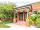 Charming brick duplex entrance with covered porch and well-maintained landscaping at 3071 W 38Th Ave, Denver, CO 80211