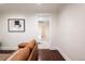 Bright hallway leading to a bedroom with hardwood floors and neutral paint at 3071 W 38Th Ave, Denver, CO 80211