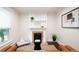 Stylish living room showcasing a classic fireplace, modern decor, and ample natural light at 3071 W 38Th Ave, Denver, CO 80211