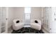 Cozy sitting area with two comfortable chairs and a stylish rug in a well-lit room at 3071 W 38Th Ave, Denver, CO 80211