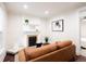 Bright living room featuring a decorative fireplace, comfortable seating, and stylish decor at 3071 W 38Th Ave, Denver, CO 80211