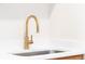 Modern kitchen sink with a sleek, gold-toned faucet and white countertops at 3071 W 38Th Ave, Denver, CO 80211
