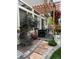 Backyard patio featuring a pergola, outdoor seating, and manicured landscaping at 10232 Yampa Ct, Commerce City, CO 80022