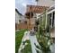 Backyard patio with pergola, lush grass and landscaping at 10232 Yampa Ct, Commerce City, CO 80022