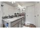 Bathroom boasting a large mirror, double vanity, granite countertops at 10232 Yampa Ct, Commerce City, CO 80022