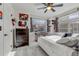 Bright bedroom with a large window, comfortable bed, and unique wall decor at 10232 Yampa Ct, Commerce City, CO 80022