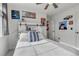 Comfortable bedroom with art, decor, and a bed with many pillows at 10232 Yampa Ct, Commerce City, CO 80022