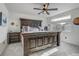 Bedroom with a ceiling fan, large window and attractive rustic furniture at 10232 Yampa Ct, Commerce City, CO 80022