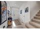 Bright entryway with wood flooring and a staircase leading to the second floor at 10232 Yampa Ct, Commerce City, CO 80022