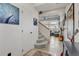 Bright entryway featuring hardwood floors, a staircase, and open access to the living area at 10232 Yampa Ct, Commerce City, CO 80022