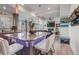 Open kitchen featuring a large island with seating, granite countertops and view to living space at 10232 Yampa Ct, Commerce City, CO 80022