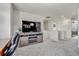 Bright loft area with an entertainment center, electric fireplace, and neutral carpeting at 10232 Yampa Ct, Commerce City, CO 80022