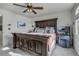 Bright main bedroom features a large bed and a vanity with a chair at 10232 Yampa Ct, Commerce City, CO 80022