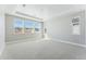 Large bedroom featuring multiple windows and carpet flooring at 9349 Russell Cir, Arvada, CO 80007