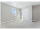 Well-lit bedroom with carpet, window, and double door closet at 9349 Russell Cir, Arvada, CO 80007