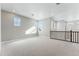 Well-lit bonus room with neutral carpet and several windows providing ample natural light at 9349 Russell Cir, Arvada, CO 80007