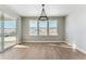 Bright dining room with hardwood floors and scenic views at 9349 Russell Cir, Arvada, CO 80007