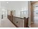 Upper level hallway offering views into the home's lower level at 9349 Russell Cir, Arvada, CO 80007