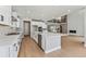 Modern kitchen with island and stainless steel appliances at 9349 Russell Cir, Arvada, CO 80007