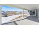 Covered patio with view of backyard and distant mountains at 9349 Russell Cir, Arvada, CO 80007