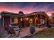 Relaxing backyard featuring a spacious deck, covered dining area, cozy lounge seating, and a stainless steel grill at 748 S Grape St, Denver, CO 80246