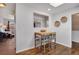 Eat-in kitchen with a skylight and a seating area with modern table and chairs at 748 S Grape St, Denver, CO 80246