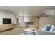 Spacious living room with an open floor plan, seamlessly connecting the kitchen and dining area with modern finishes at 1337 N Alton St, Aurora, CO 80010
