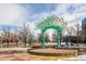 Town square featuring public art, colorful structures, landscaping, and gathering spaces at 1337 N Alton St, Aurora, CO 80010