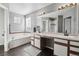 Bright bathroom with a large vanity and soaking tub at 13033 Birch Dr, Thornton, CO 80241