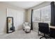 Bedroom with a window, seating, carpet, and a desk for working at home at 13033 Birch Dr, Thornton, CO 80241