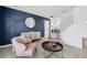 Stylish living room with an accent wall, lots of natural light, and neutral colors at 13033 Birch Dr, Thornton, CO 80241