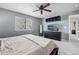 Lovely main bedroom with a view, ceiling fan, TV, and built-in storage at 13033 Birch Dr, Thornton, CO 80241