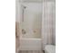 Bright bathroom featuring a shower and bathtub with a patterned shower curtain at 3251 N Madison St, Denver, CO 80205