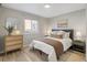 Bright bedroom featuring neutral-toned walls, hardwood floors, and a comfortable bed at 3251 N Madison St, Denver, CO 80205