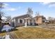 Single-Gathering home featuring fenced yard, manicured lawn, and inviting entrance at 3251 N Madison St, Denver, CO 80205